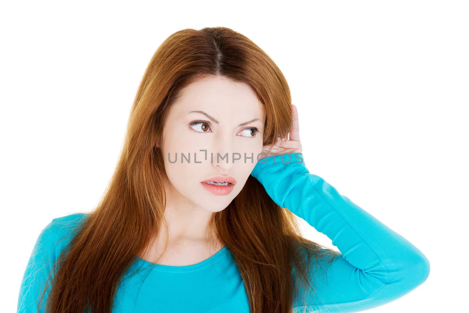 Surprised woman trying to listening a gossip , isolated on white