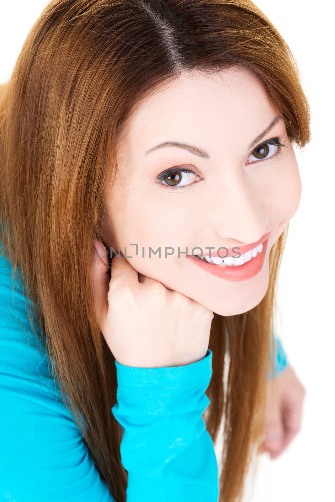 Happy attractive woman sitting, isolated on white