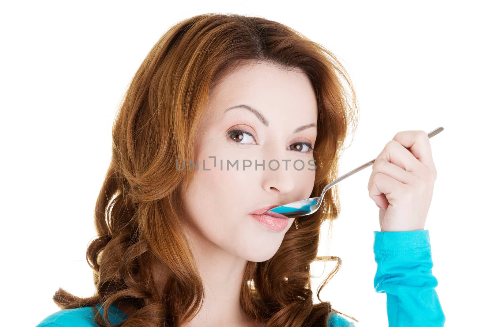 Portrait of woman with spoon in her mouth by BDS