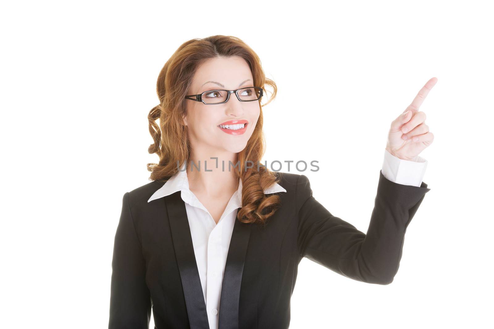 Happy success business woman pointing on copy space, isolated on white