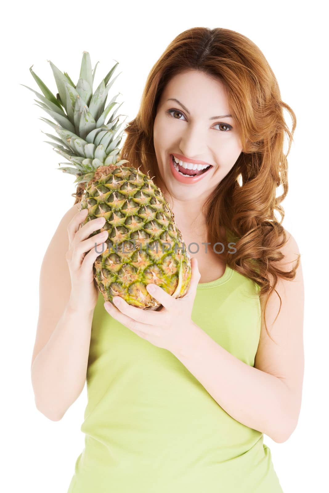 Happy woman with fresh pineapple fruit, isolated on white