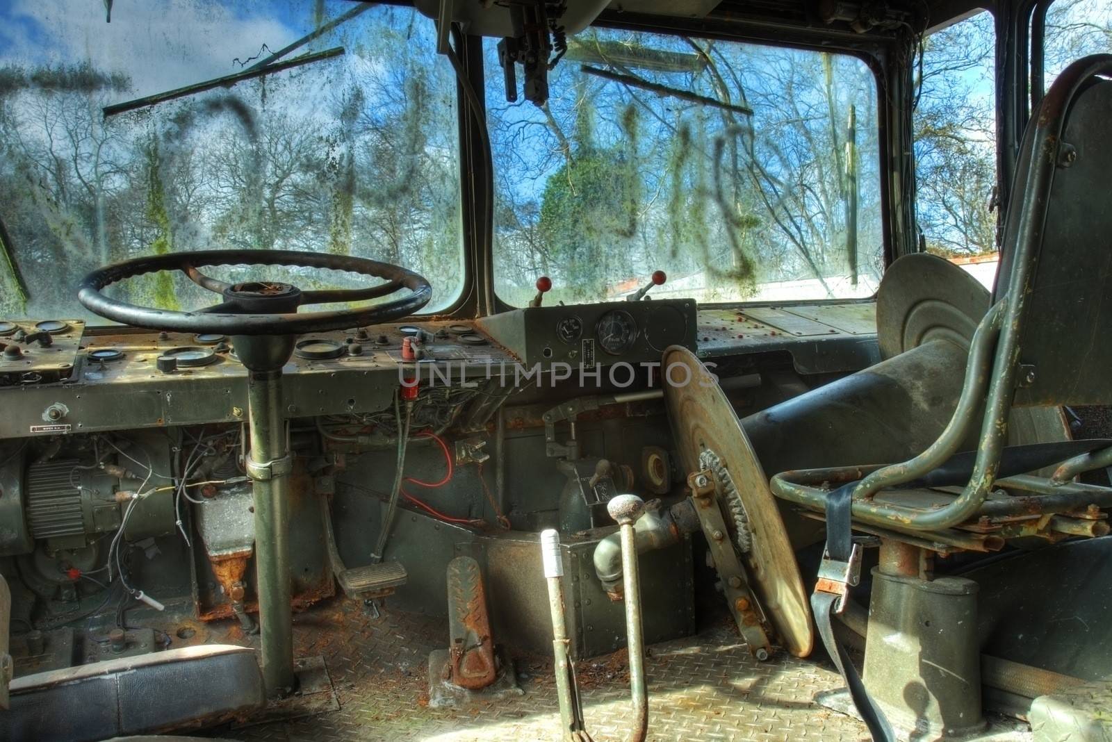 Old military vehicle interior at scrapyard, England.