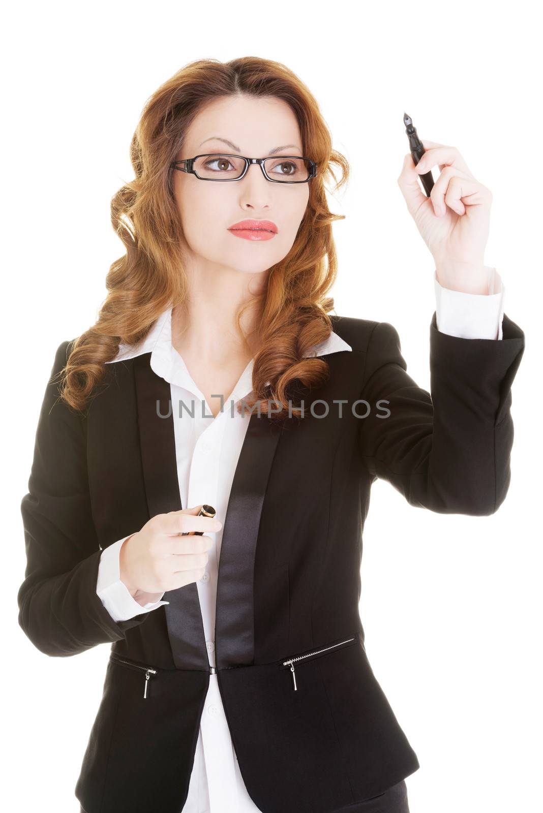 Businesswoman writing something on abstract screen by BDS