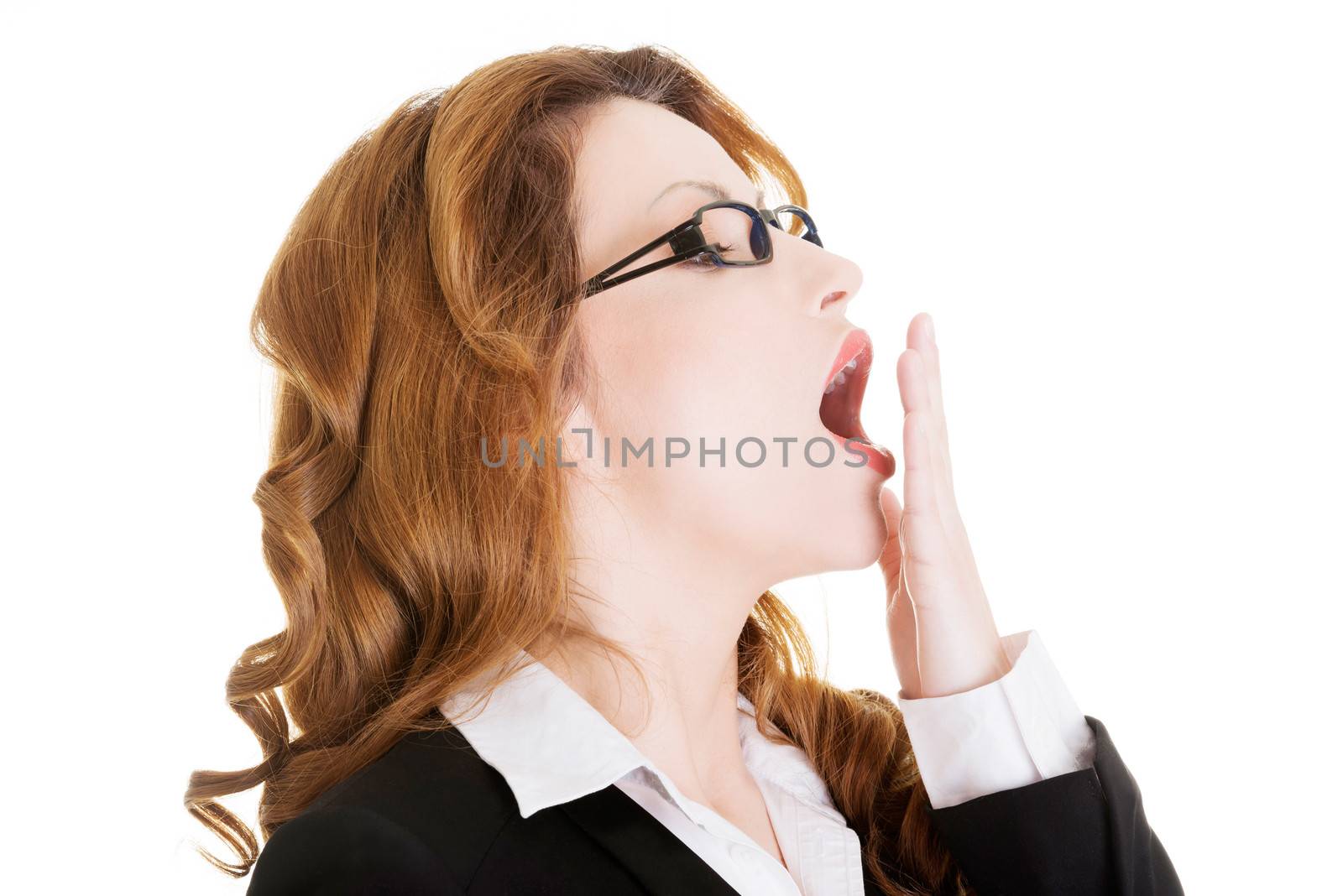 Tired business woman in a suit ,isolated over white background