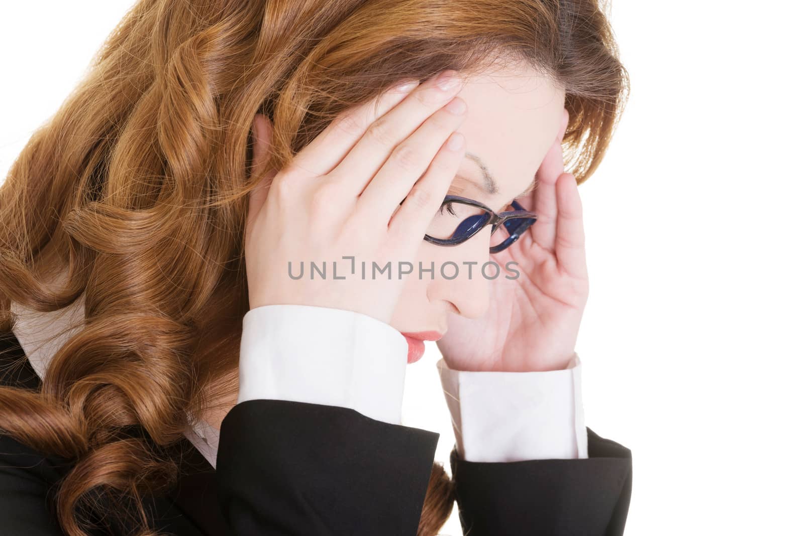 Businesswoman with a headache holding head, isolated on white background