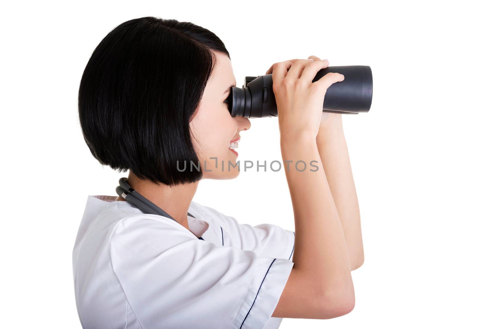 Looking in the futere of health care. Female doctor or nurse looking through binoculars.