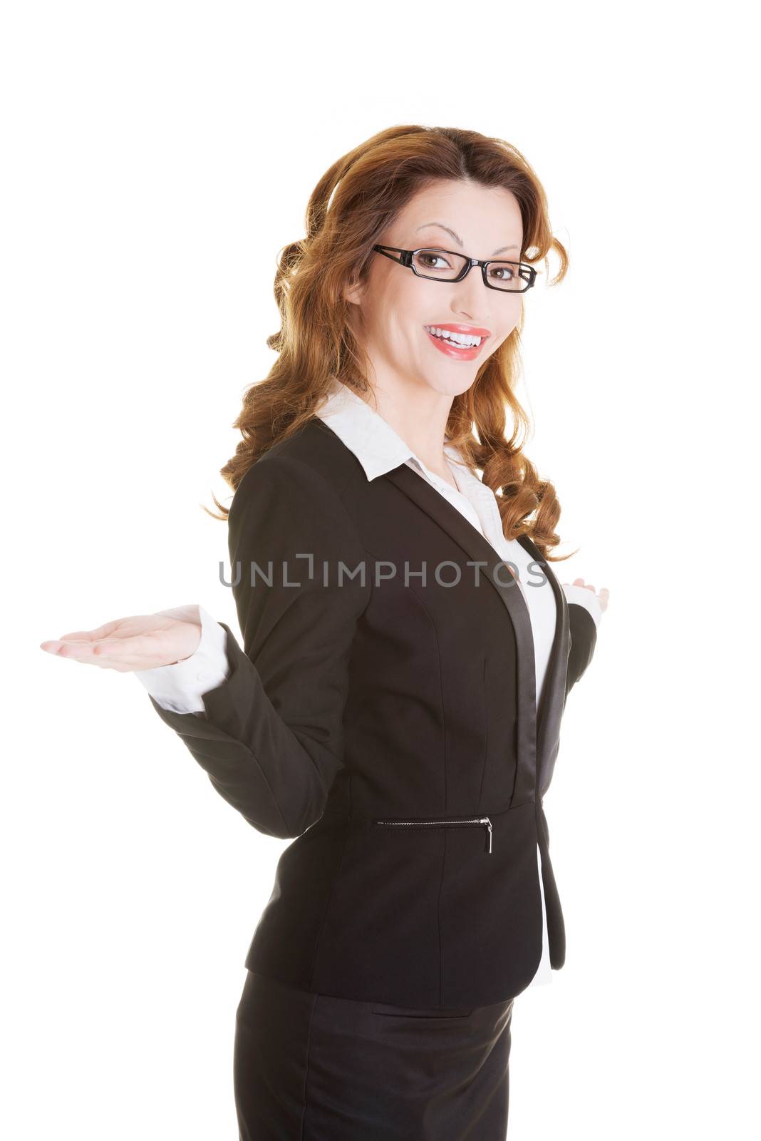 Happy business woman showing copy space by BDS