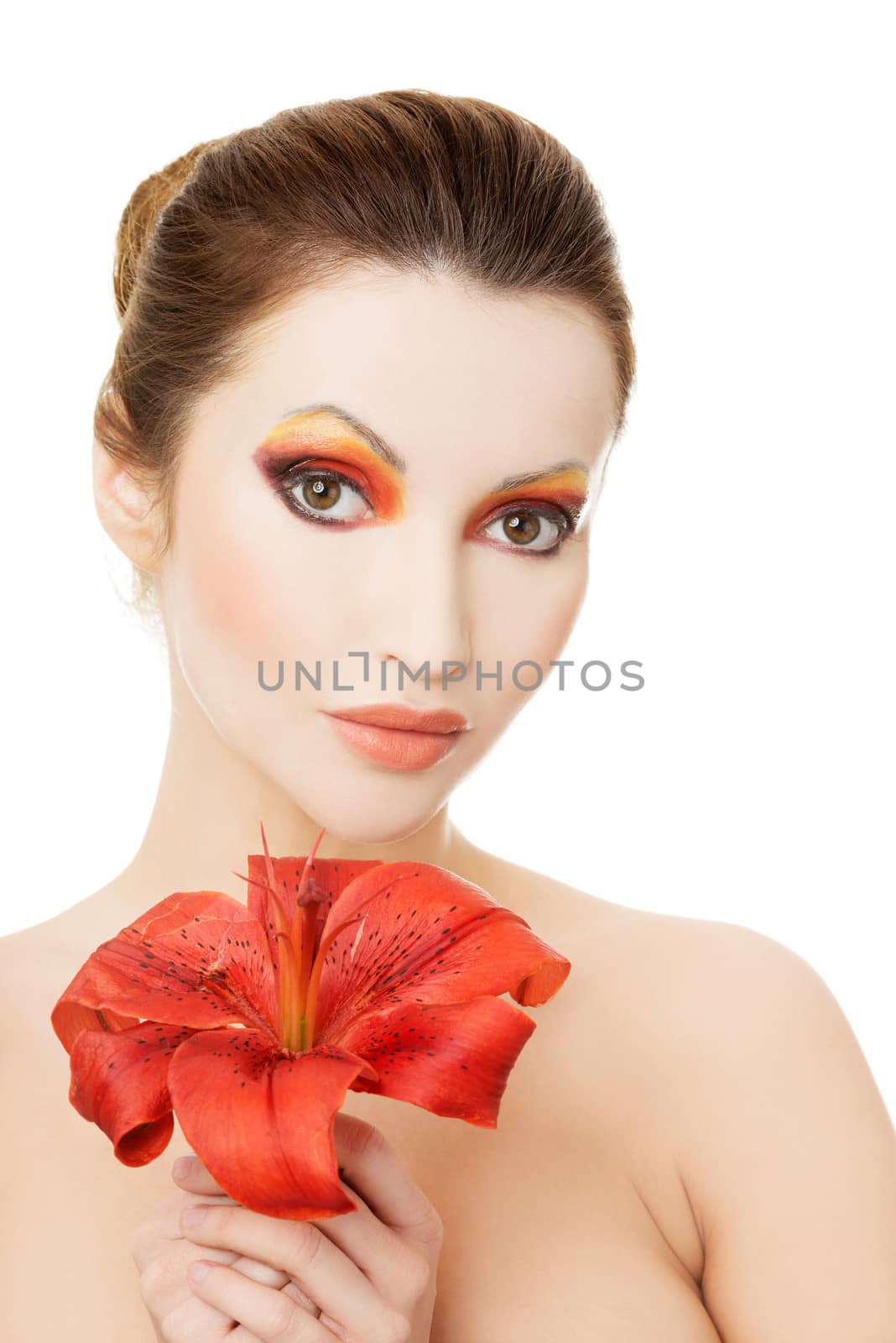 Beautiful woman with a red lily, isolated on white