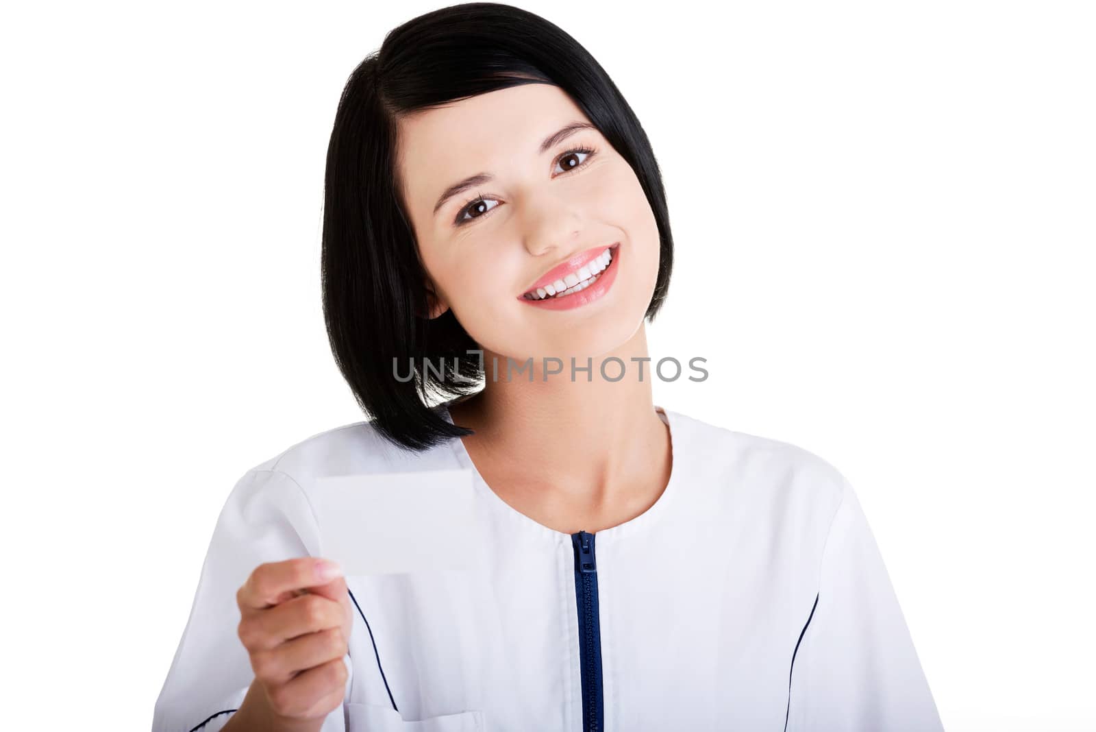 Woman doctor or nurse holding business card in her hand