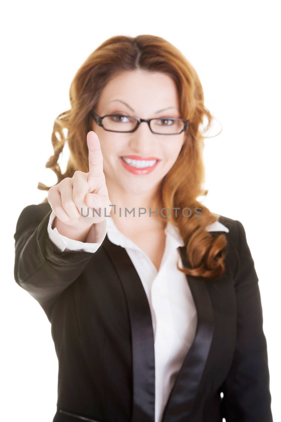 Attractive smiling businesswoman making choose on abstract screen