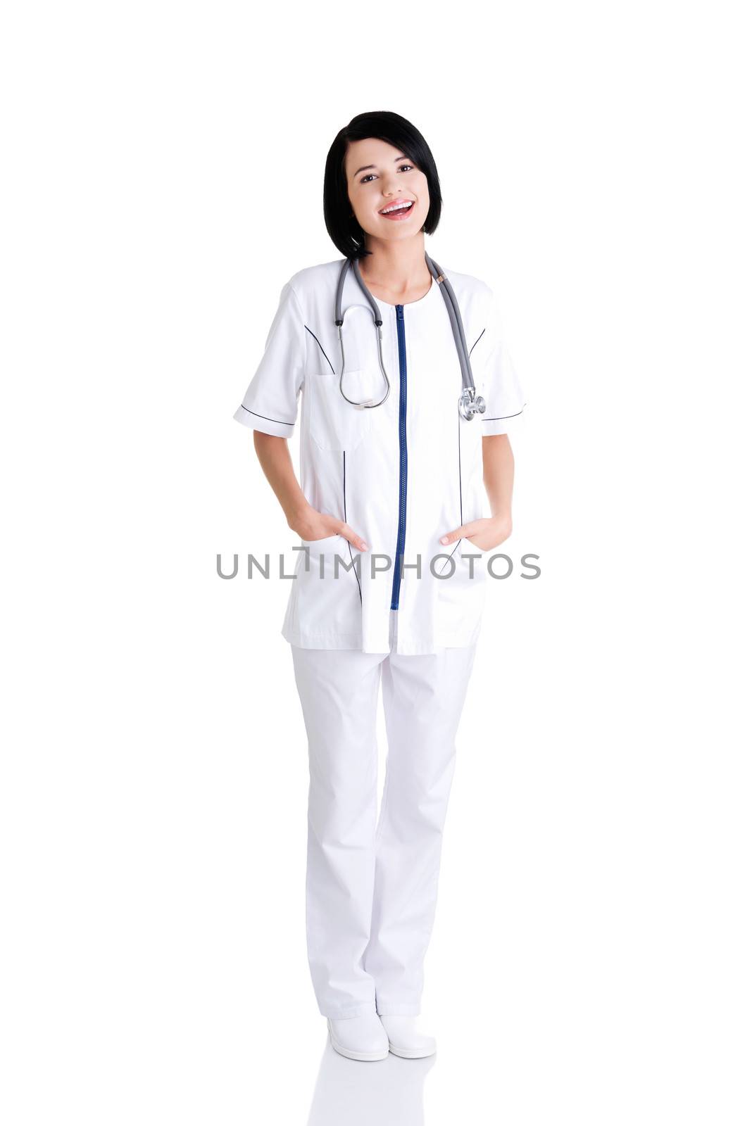 Nurse or young doctor standing smiling. by BDS