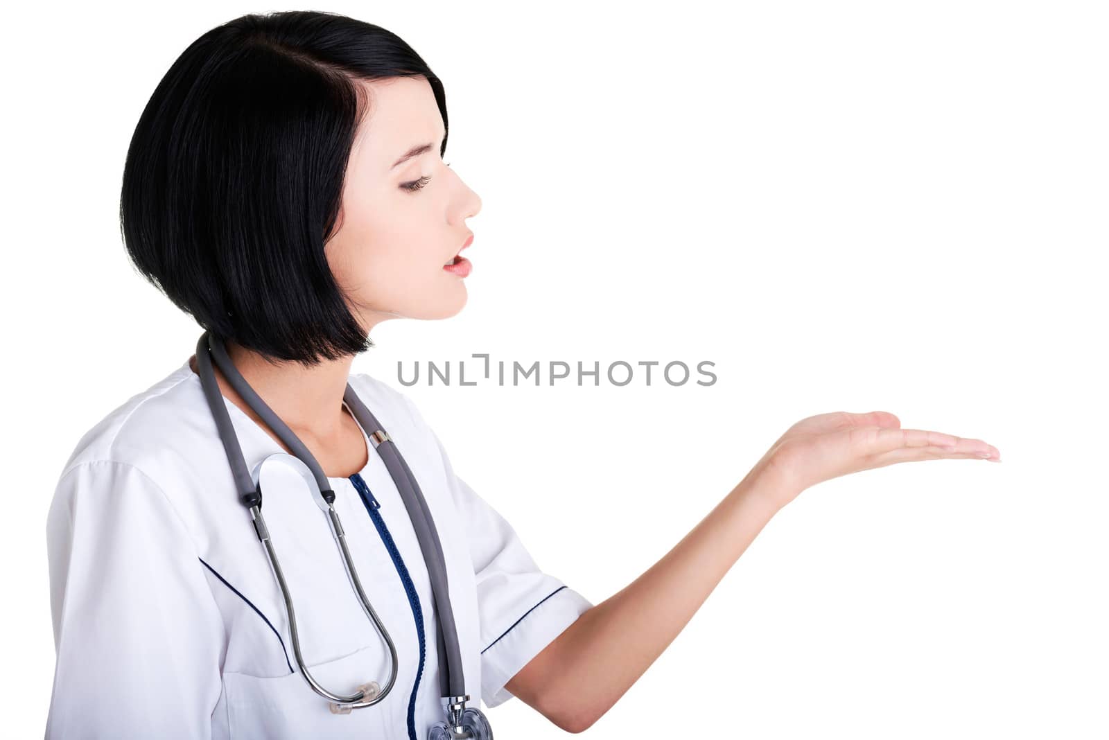 Medical doctor woman or nurse presenting and showing copy space for product or text, isolated on white background