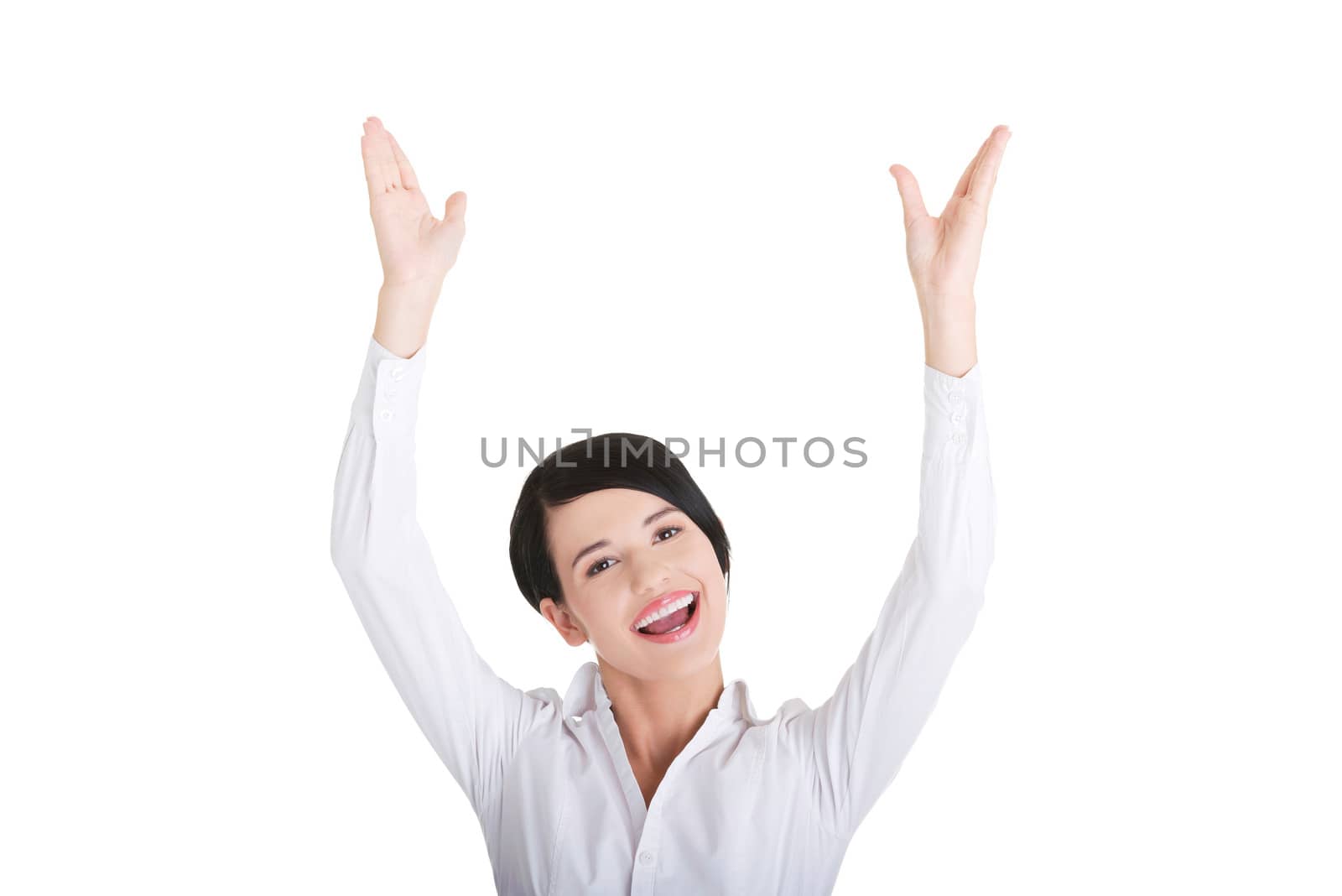 Young happy businesswoman with hands up by BDS