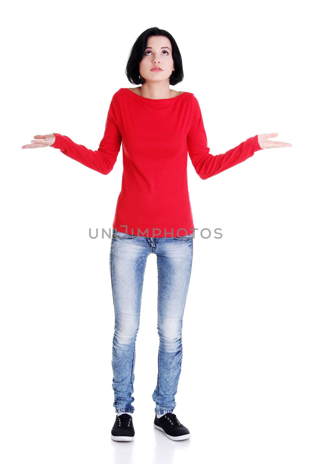 Young female gesturing do not know sign ,against white background