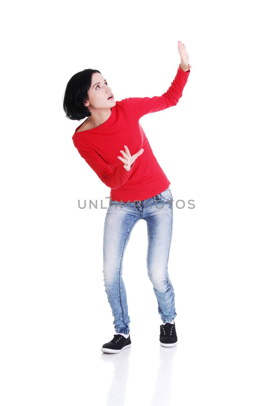 Scared woman defending herself, isolated on white background