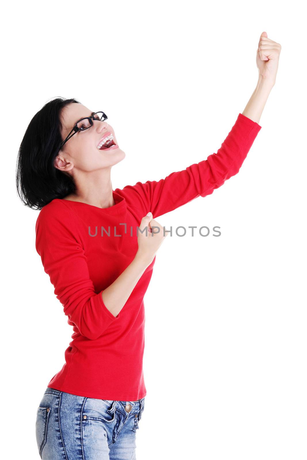 Excited happy young woman with fists up, isolated