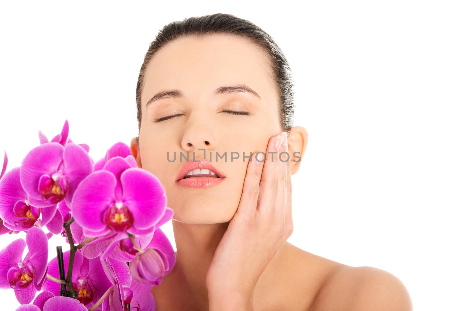 Young woman with health skin and orchid by BDS