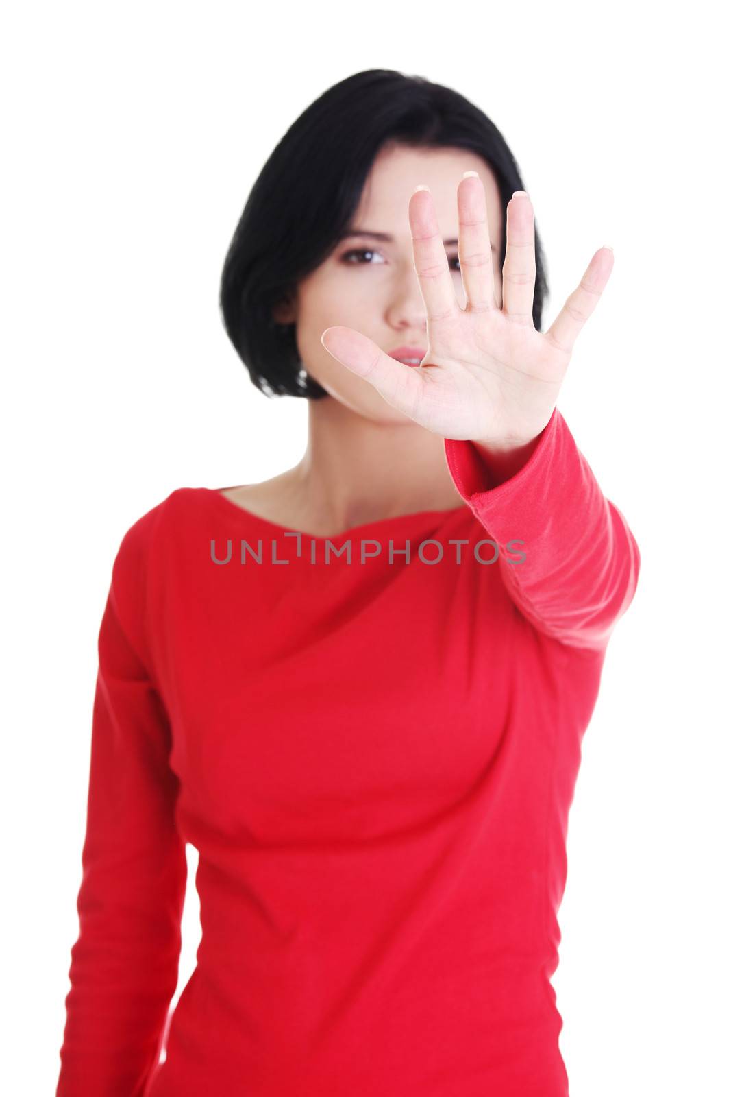 Confident woman making stop gesture by BDS