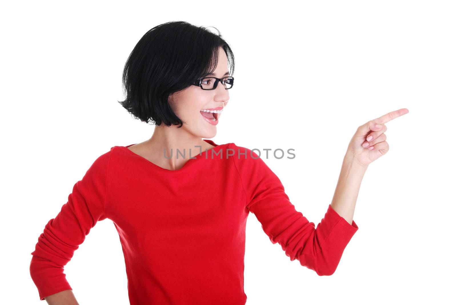 Excited young woman pointing on copy space by BDS