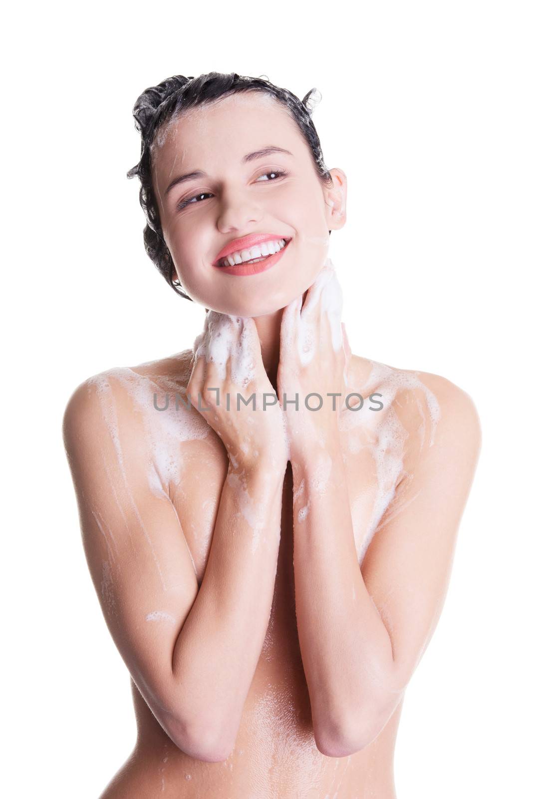 Young fit woman in shower washing her body