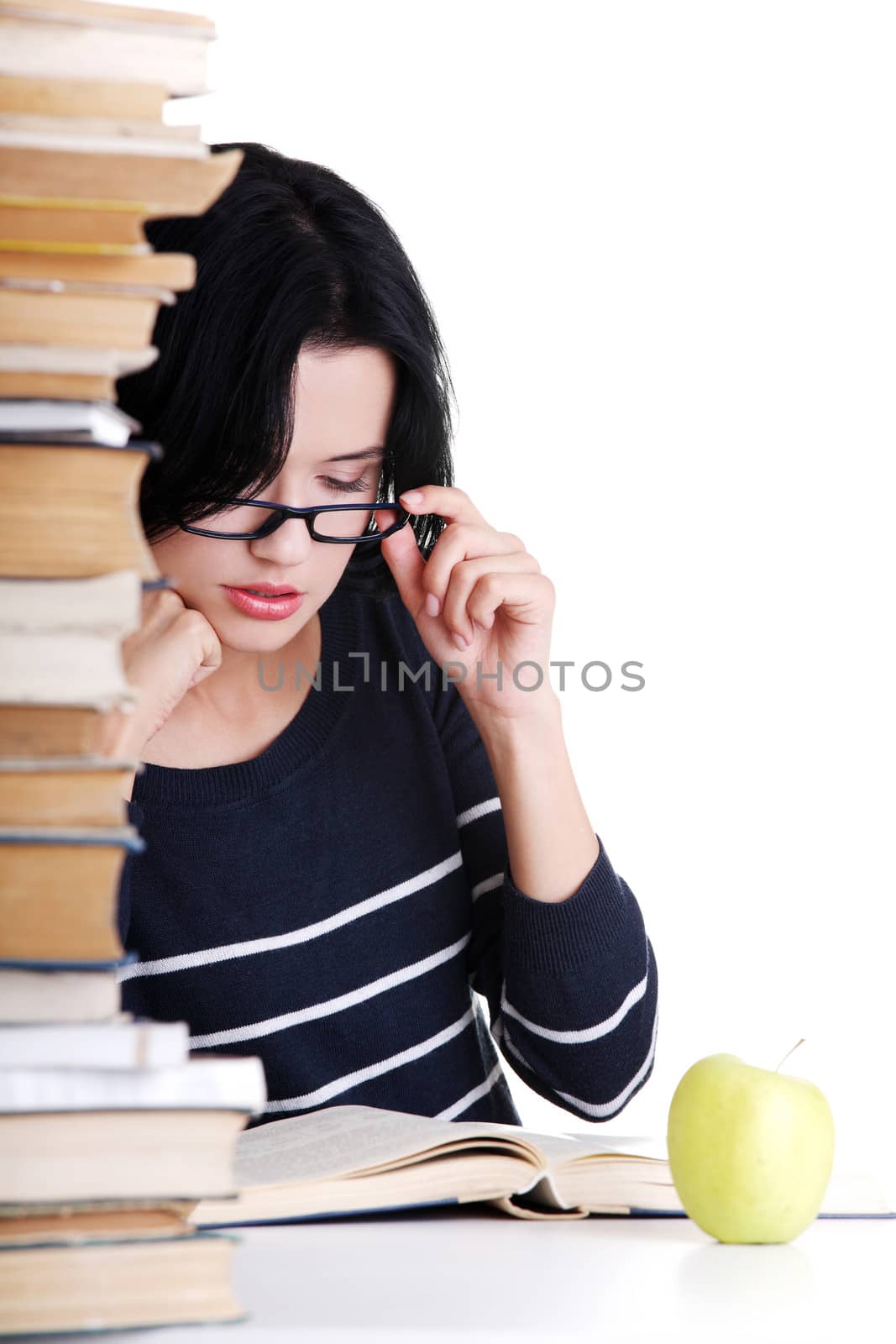 Young student woman studying at the desk by BDS