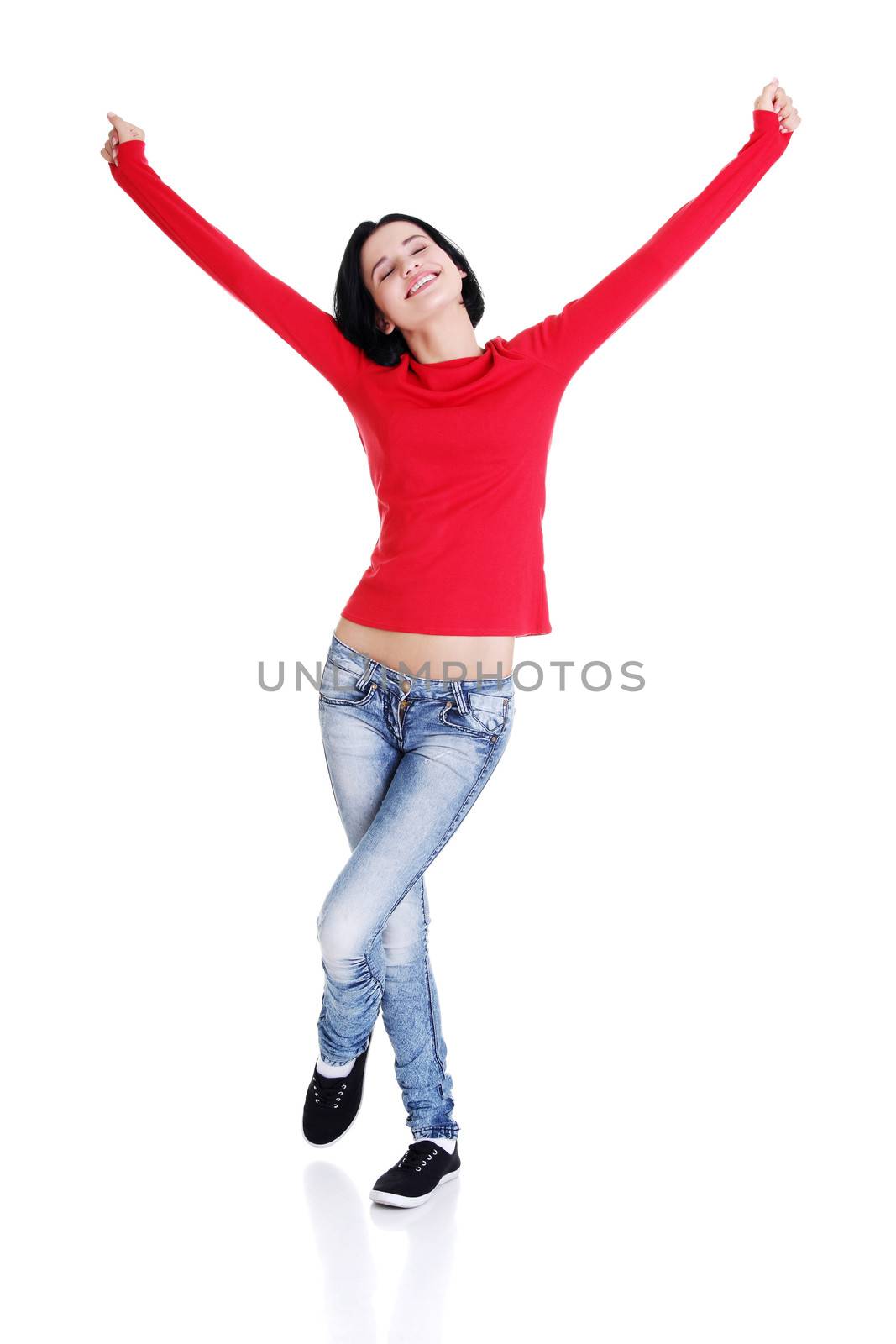 Excited young woman with fists up by BDS