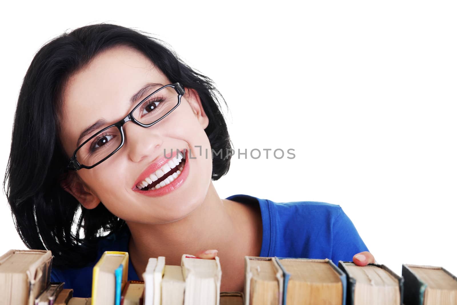 Happy smiling young student woman with books by BDS