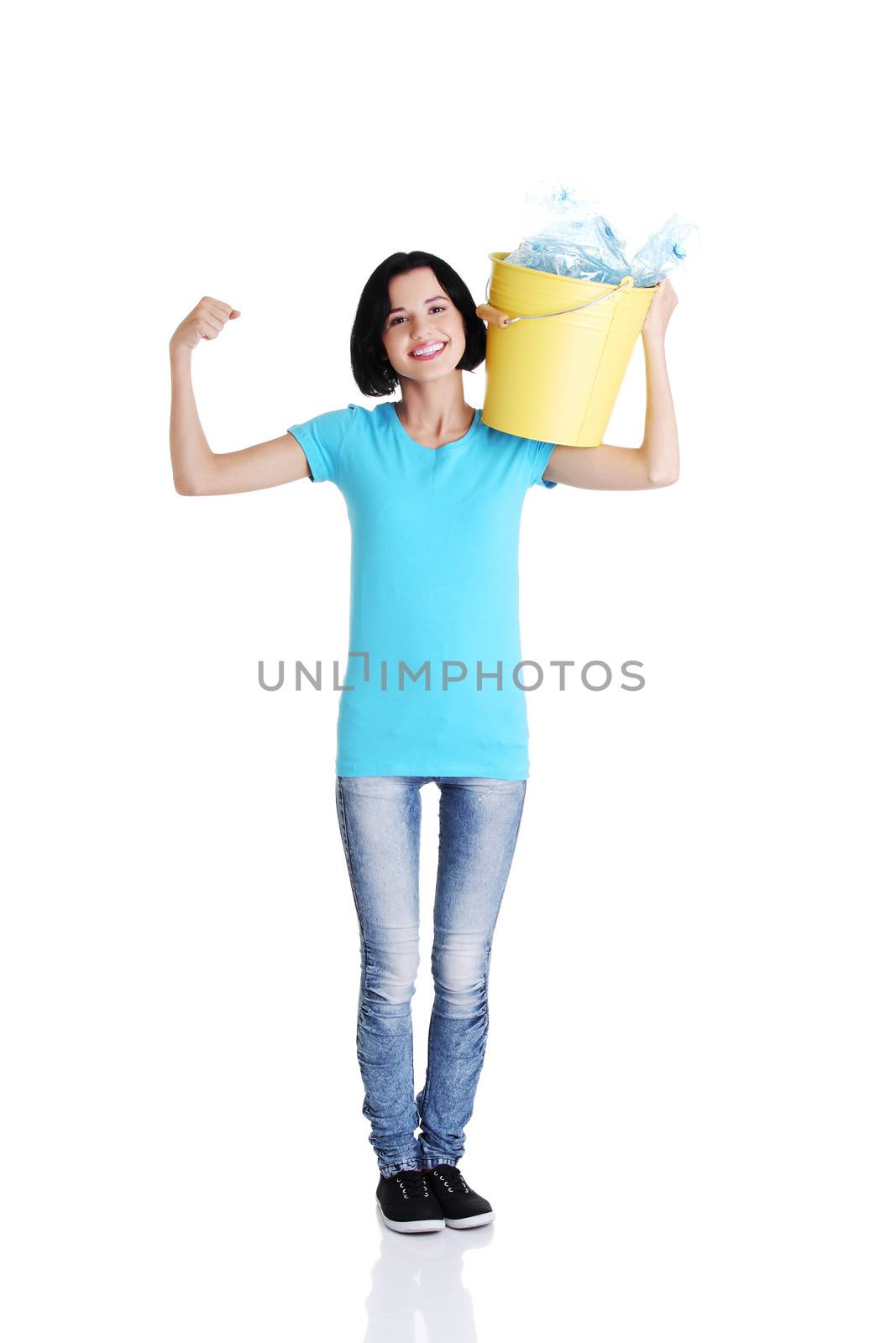 Beautiful young woman holding recycling bin isolated on white background.