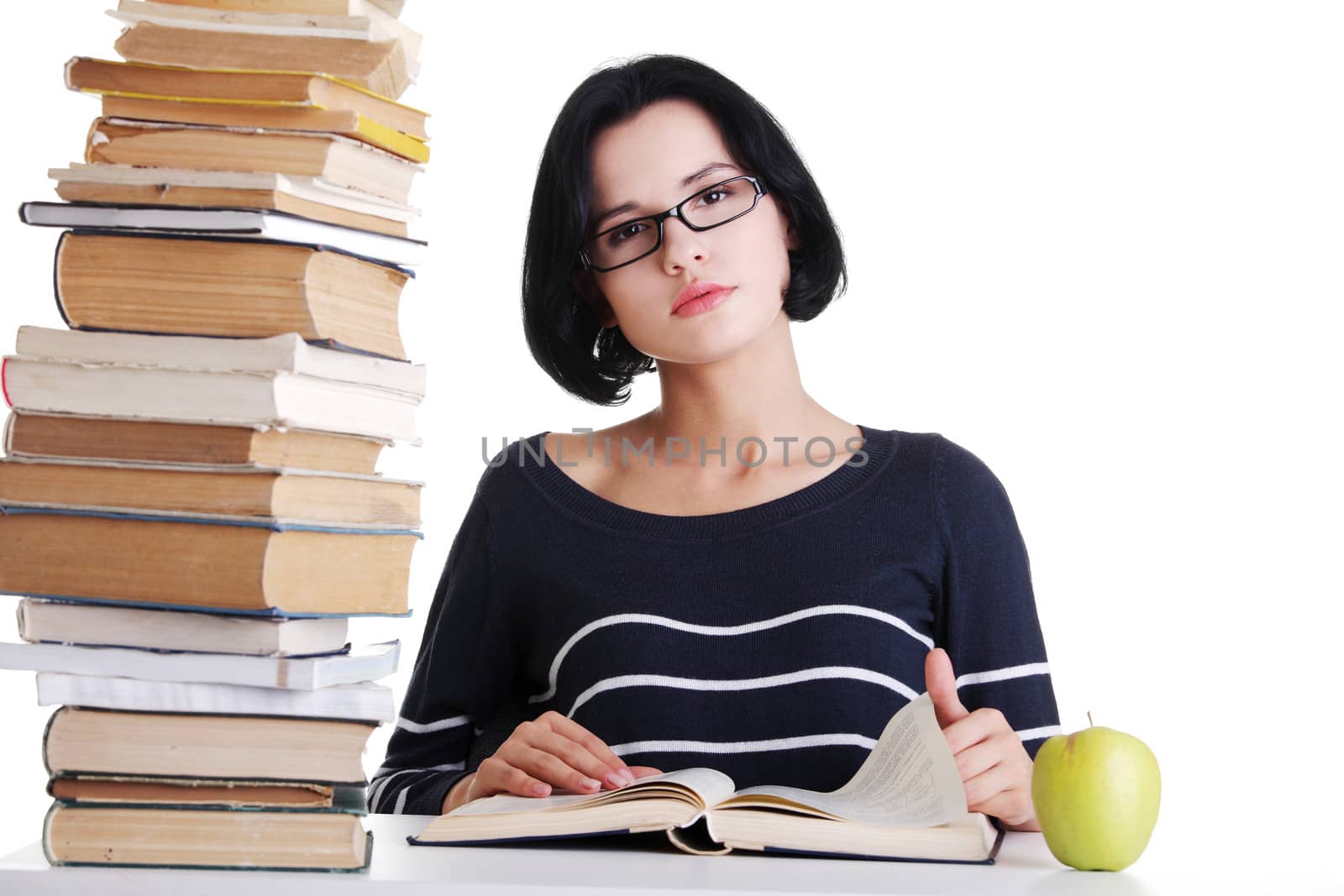 Young student woman studying at the desk by BDS