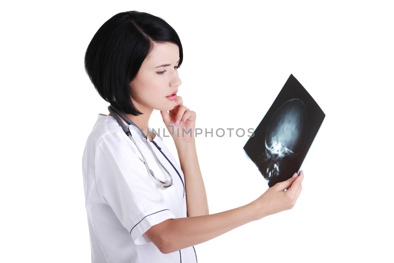 Female doctor or nurse looking at radiography photo by BDS