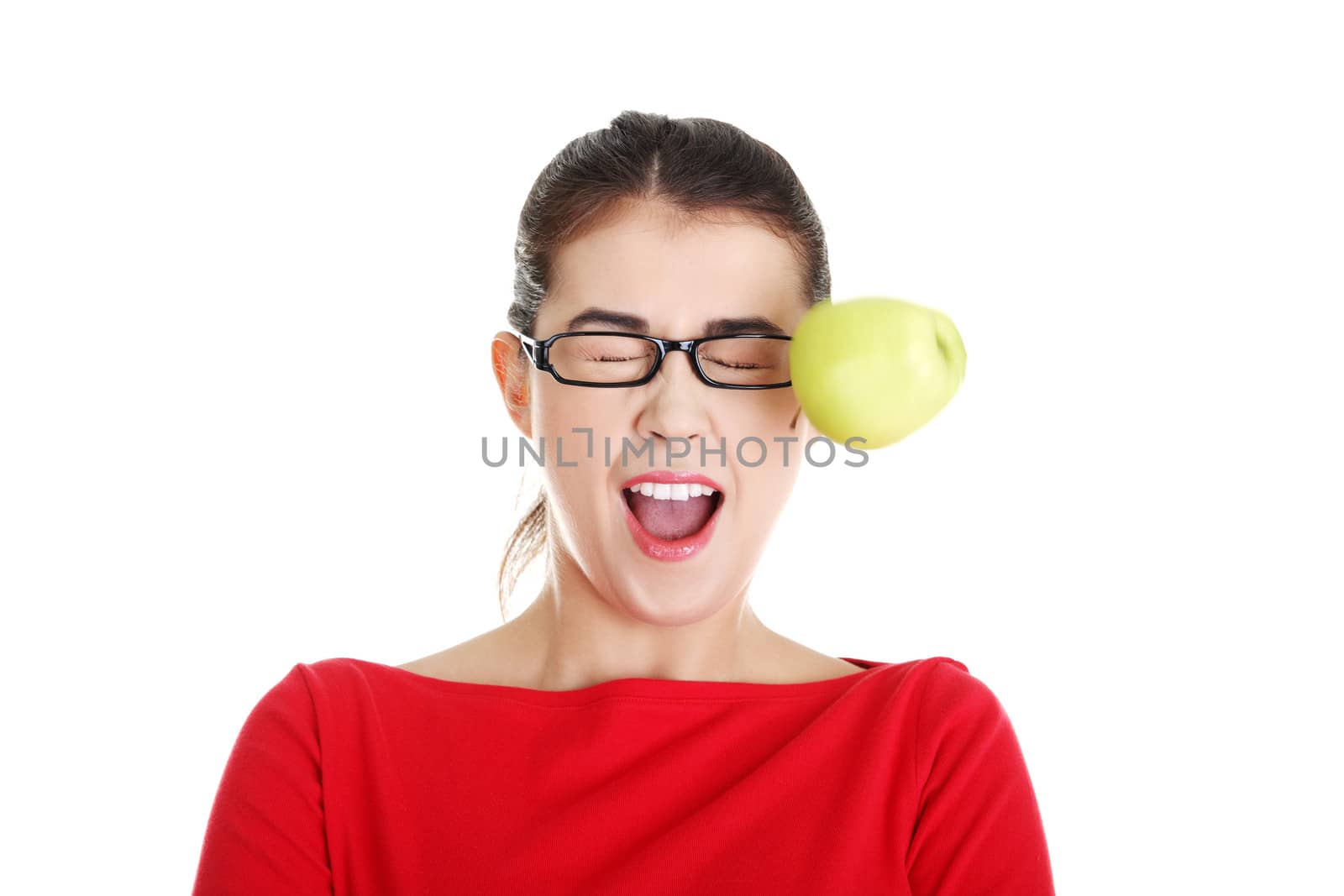 Casual woman in glasses hit by apple, isolated on white