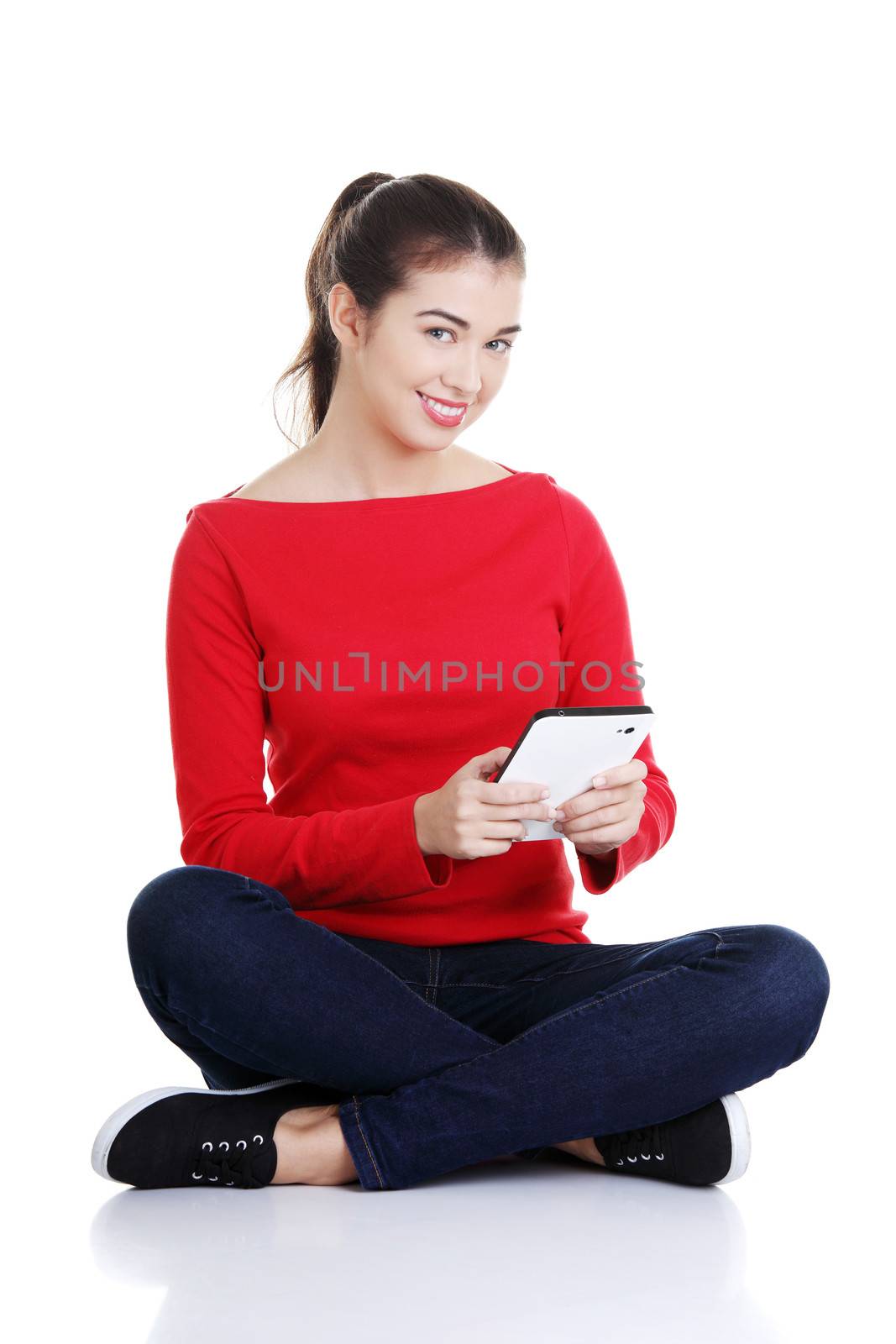 Woman working on tablet computer by BDS