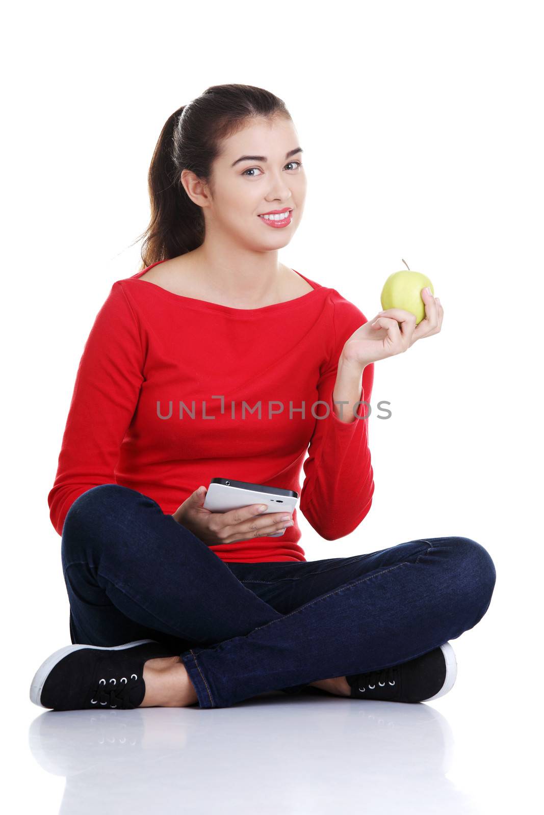Woman with apple and tablet computer. Isolated on white background.