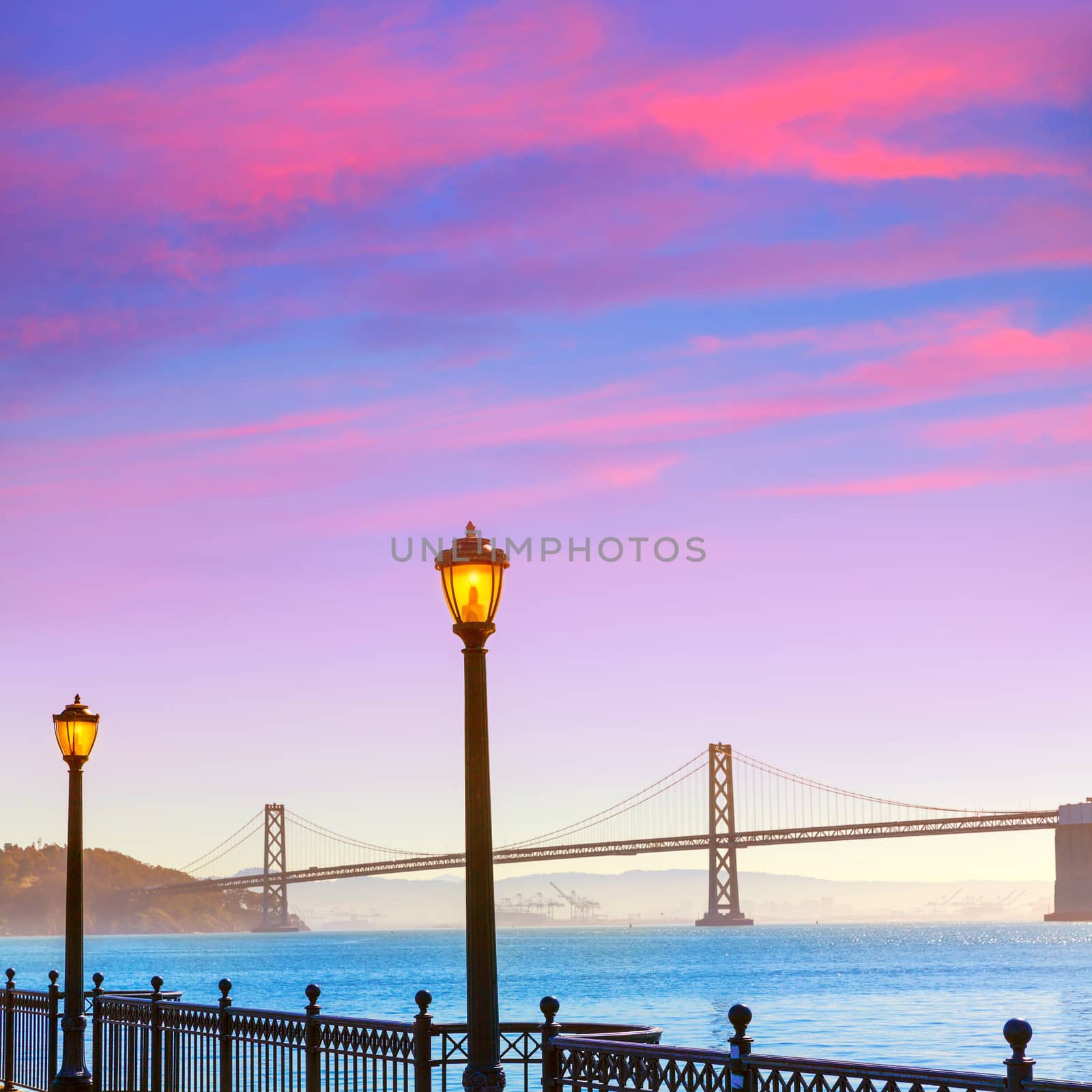 San Francisco Bay bridge from pier 7 in California sunset USA