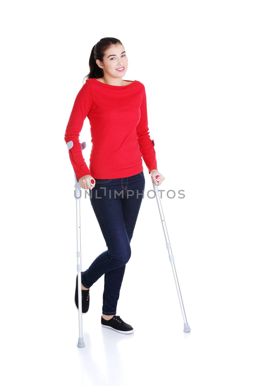 Woman walking with crutches by BDS