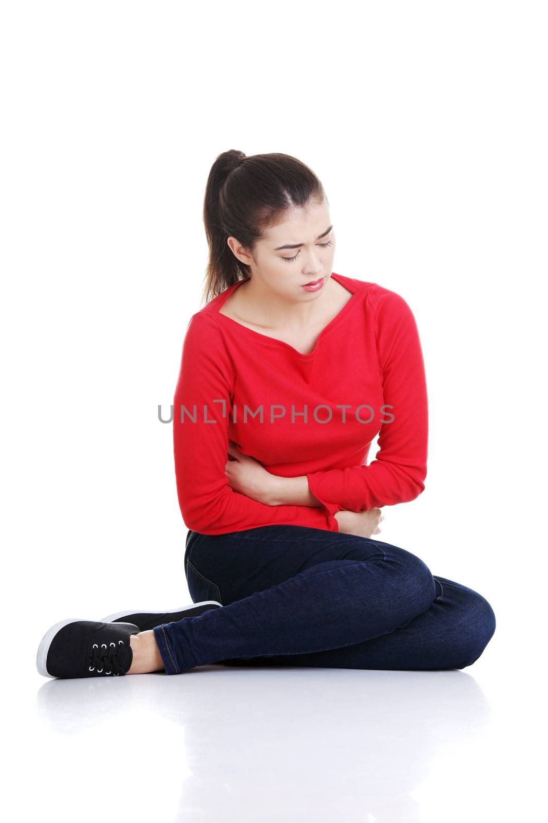 Woman with stomach issues isolated on white background