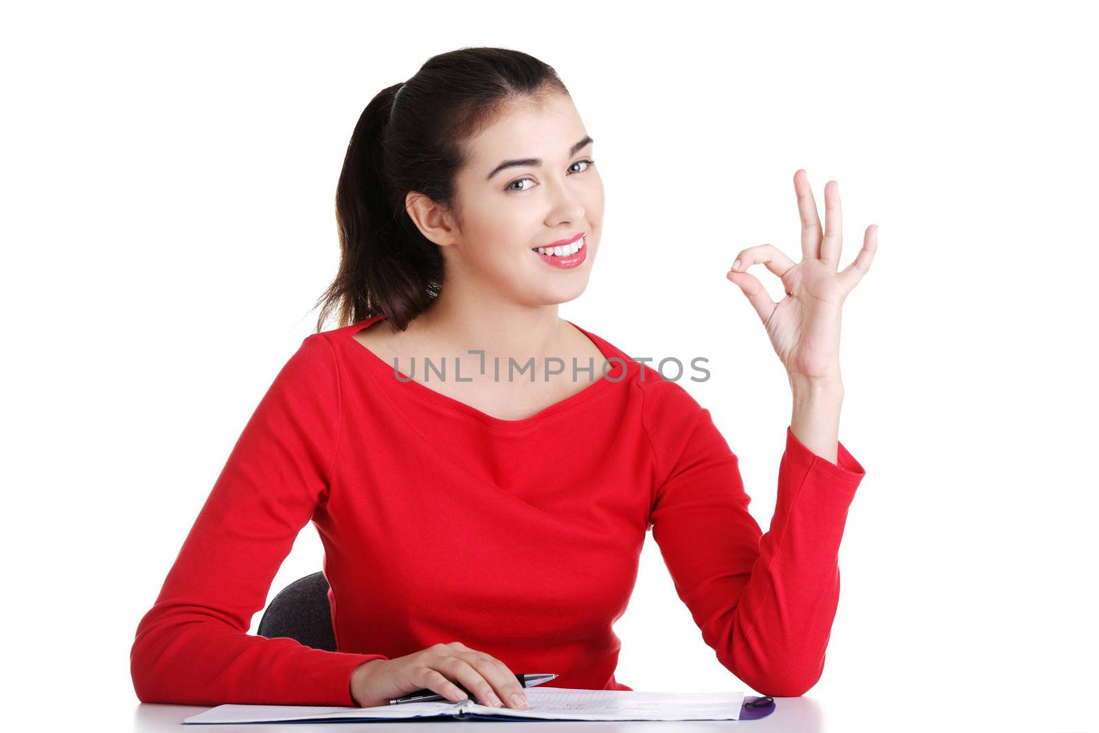 Adult student woman learnig at the desk, isolated on white background