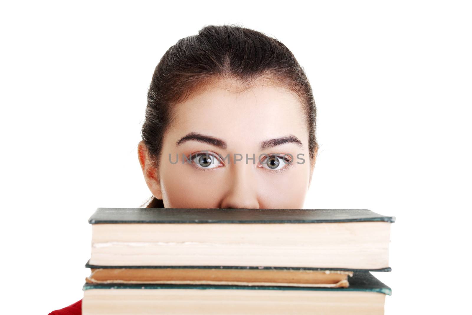 Young woman behind an old books by BDS