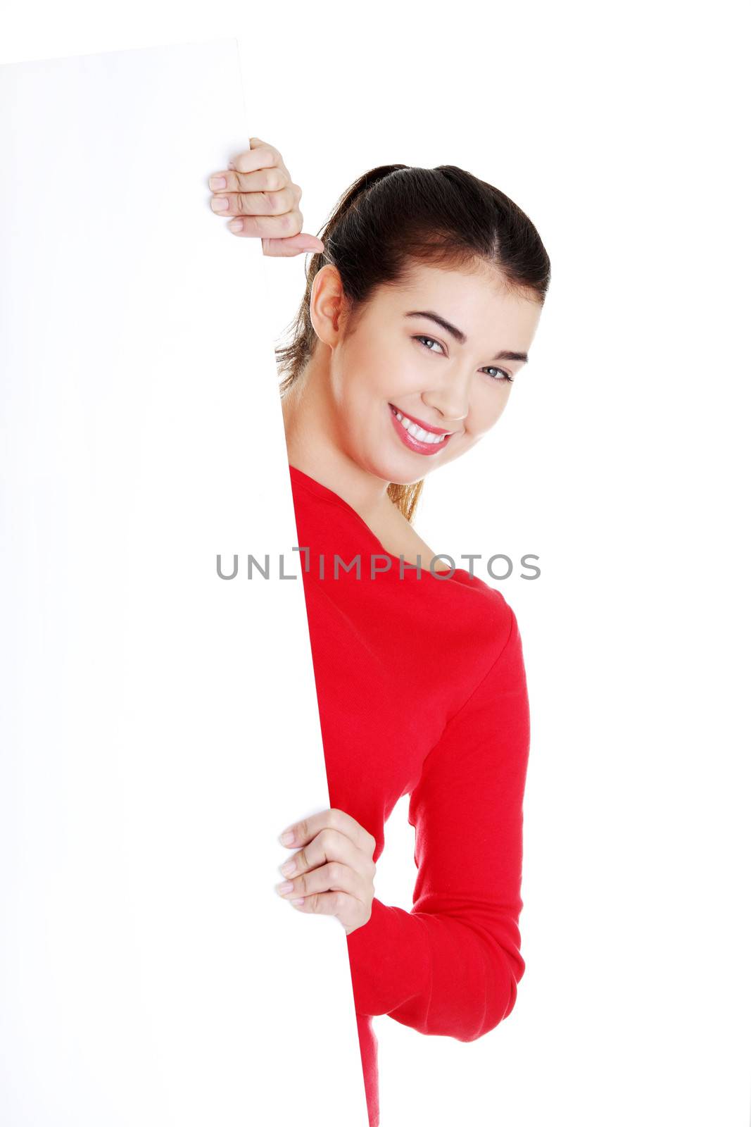 Portrait young happy woman with blank board isolated on white