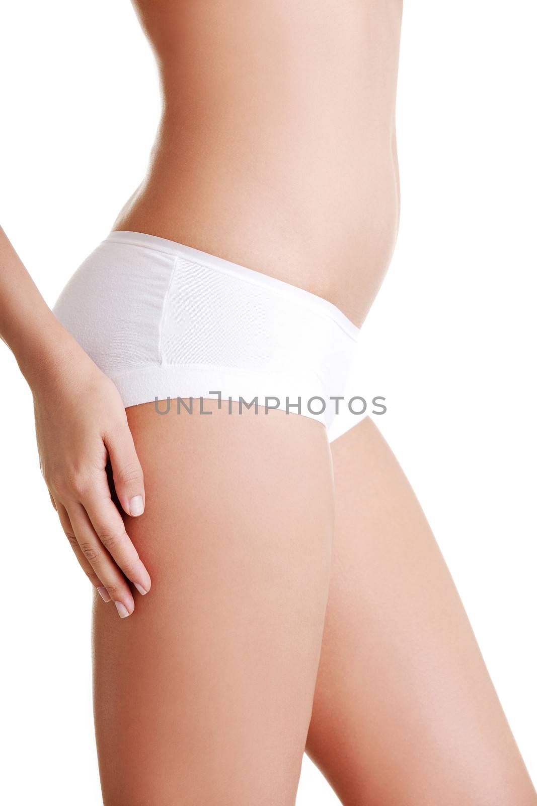 Slim tanned woman's body. Isolated over white background.