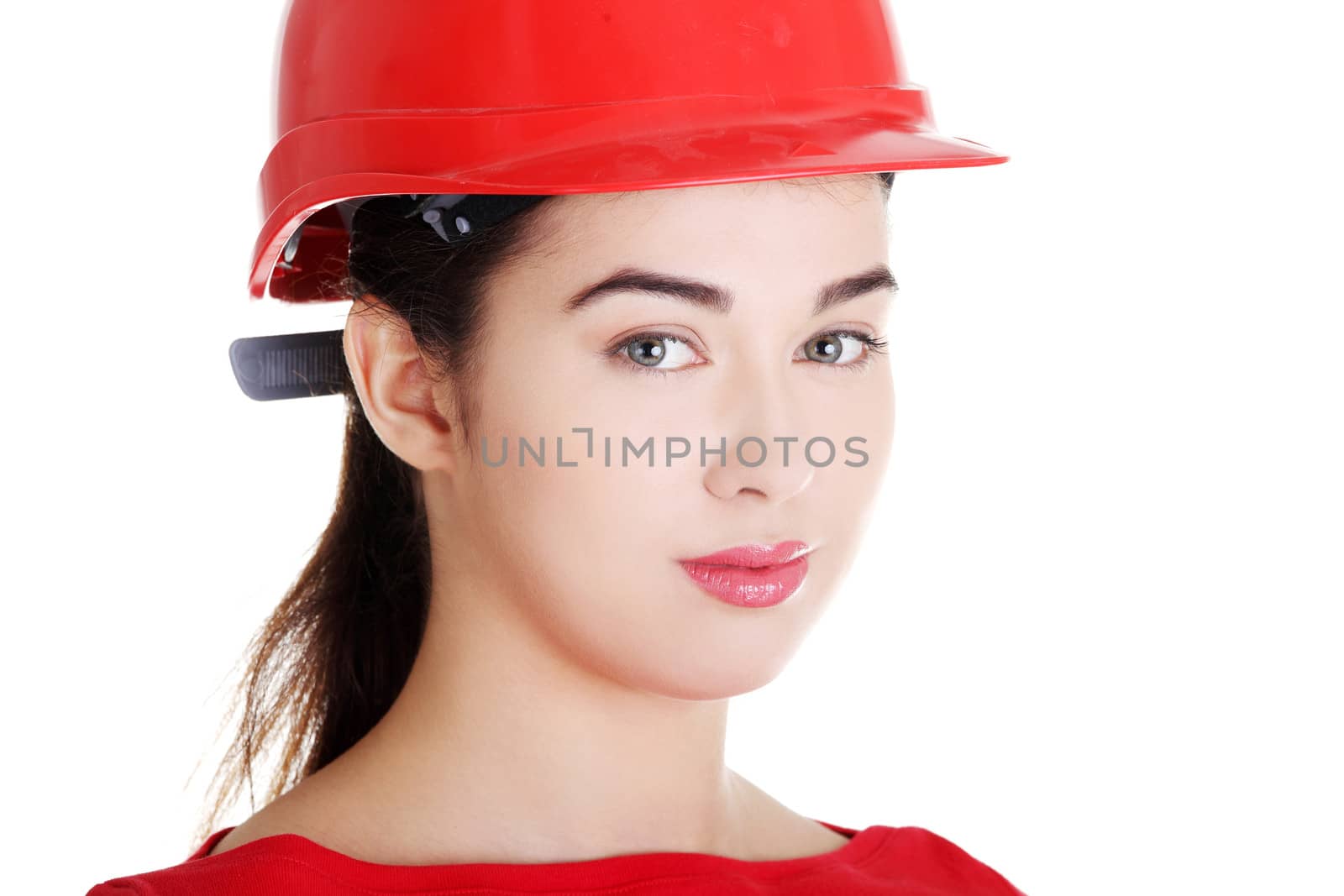 Portrait of confident female worker in helmet. Isolated on white