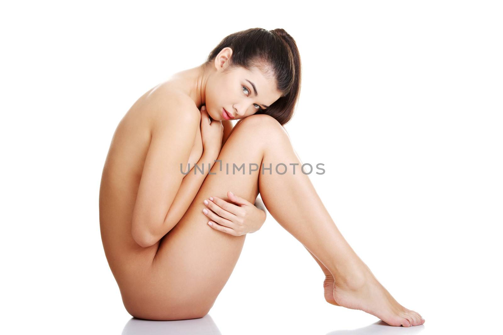 Sexy fit naked woman with healthy clean skin, isolated on white background