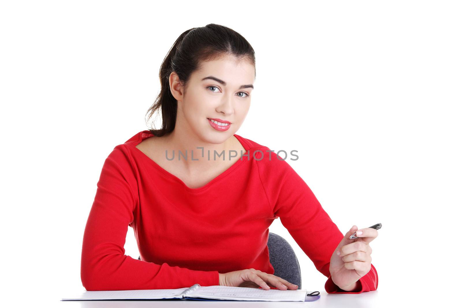 Adult student woman learnig at the desk, isolated on white background