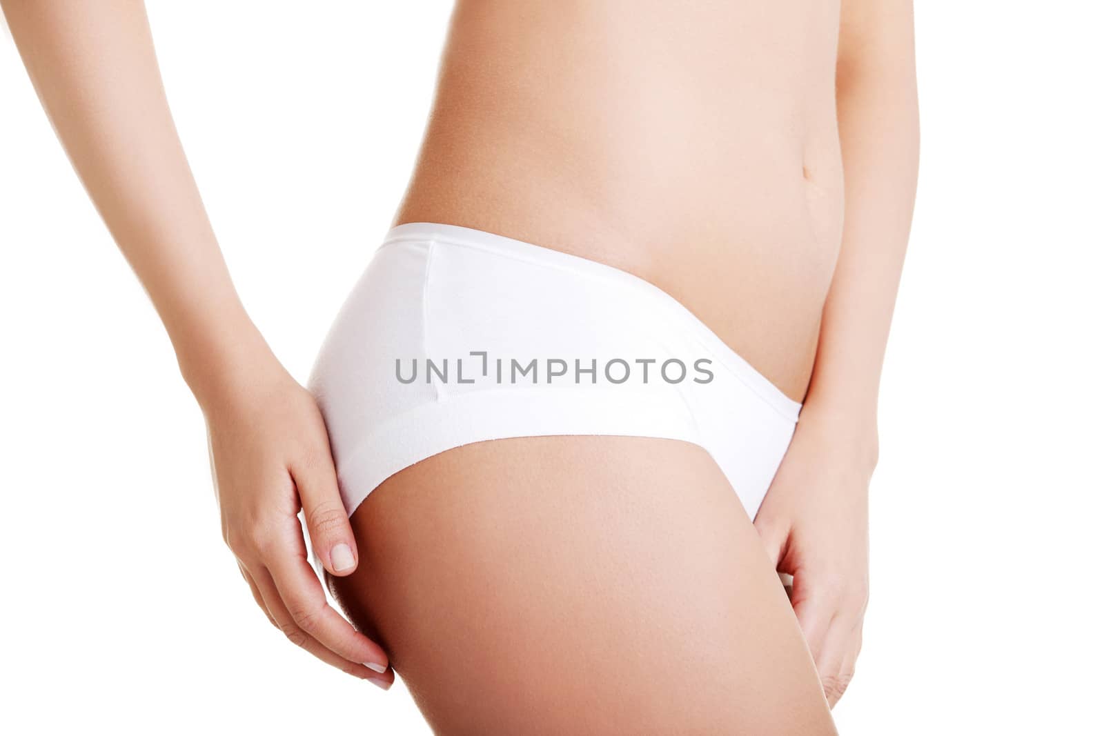 Slim tanned woman's body. Isolated over white background.