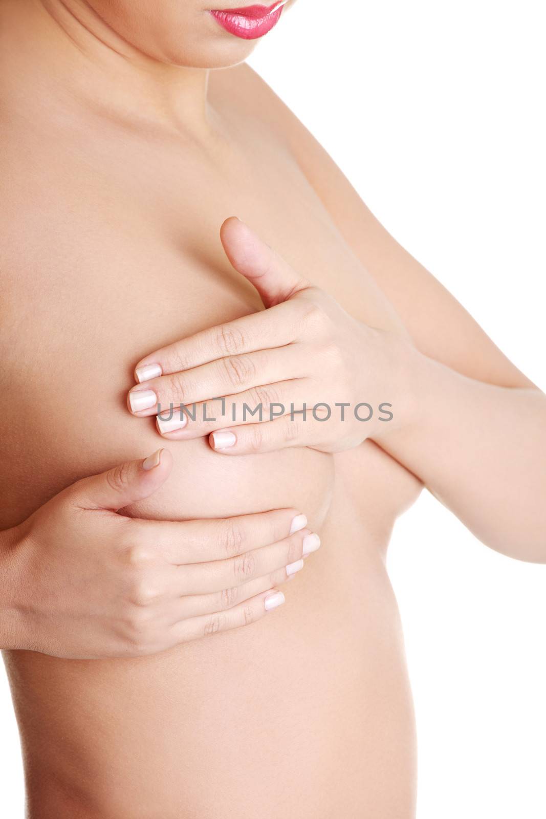 Woman examining breast mastopathy or cancer. by BDS