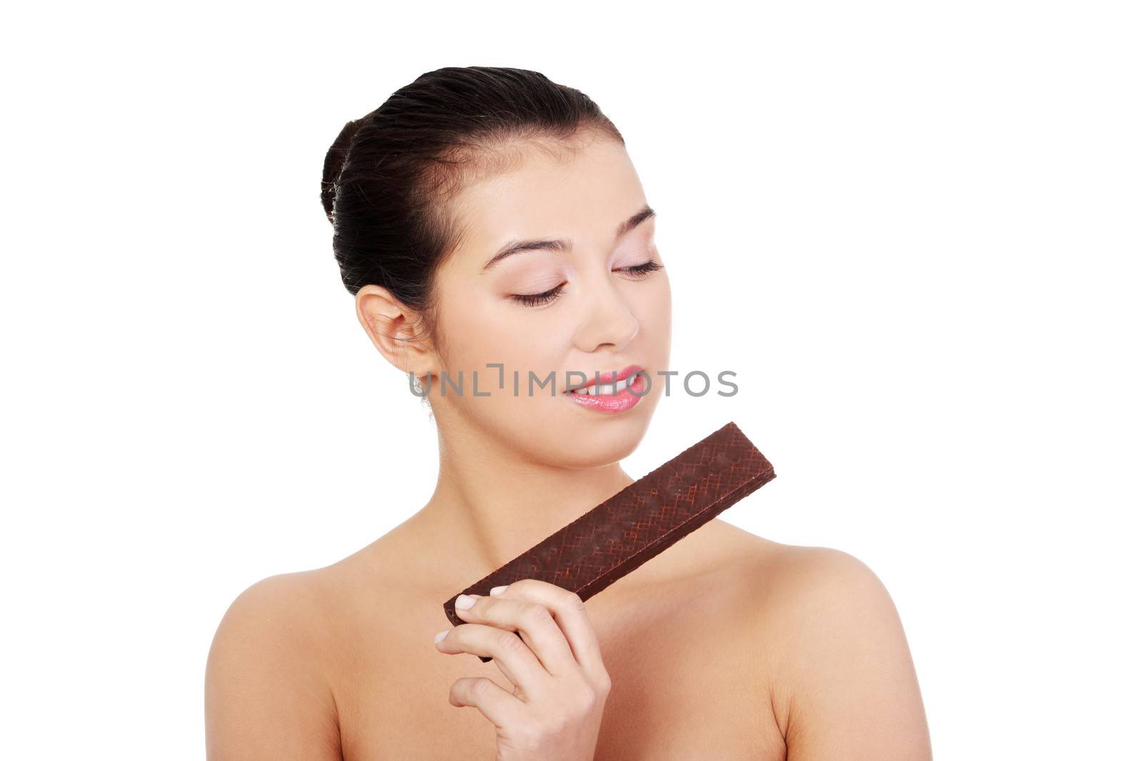 Pretty happy smiling woman eating chocolate waffle, isolated on white