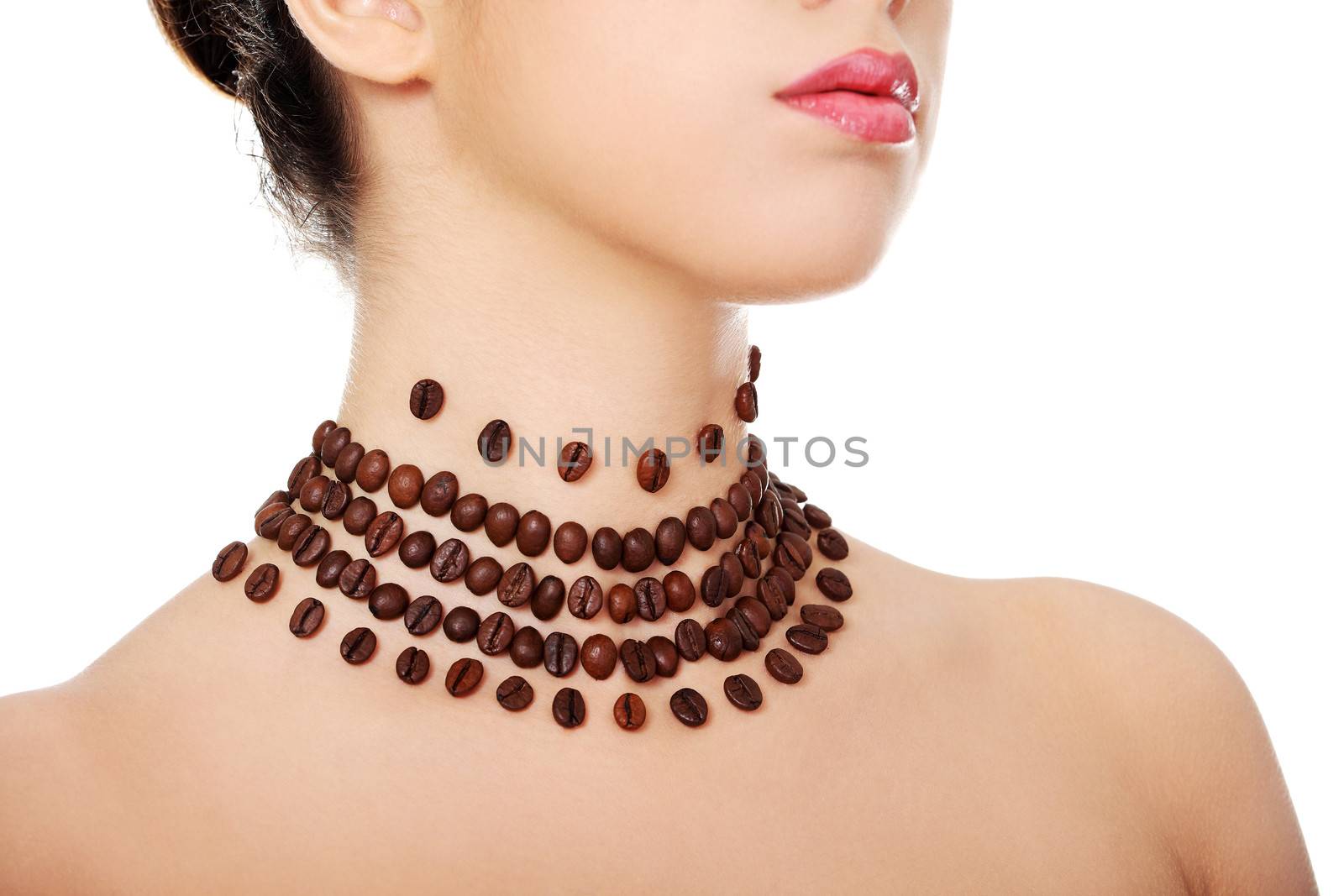 Beautiful elegant young woman with necklace made frome coffee beans, isolated on white