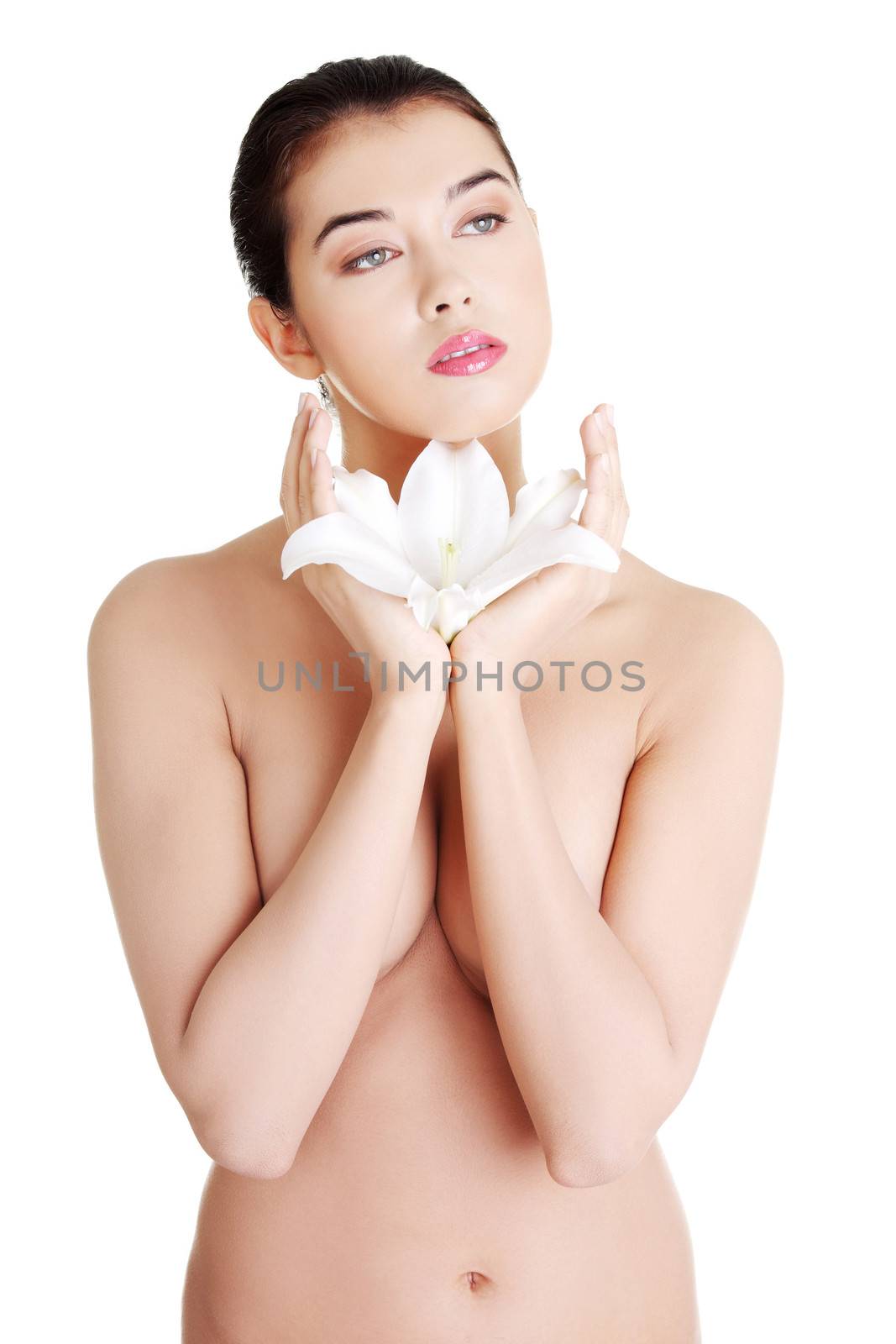 Portrait of beautiful young woman with health skin holding lily flower , isolated on white