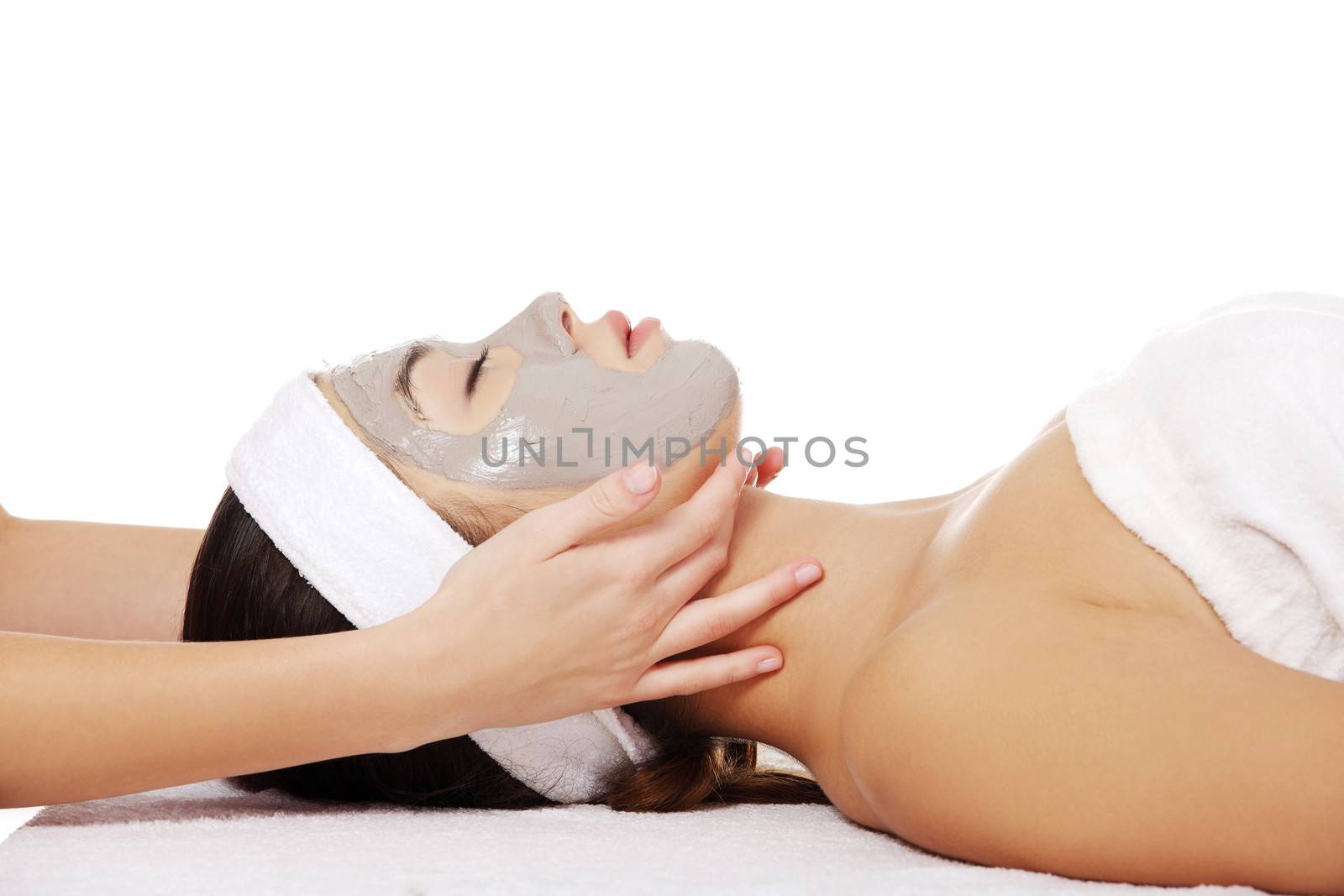 Beautiful young relaxed woman enjoy receiving head massage at spa saloon