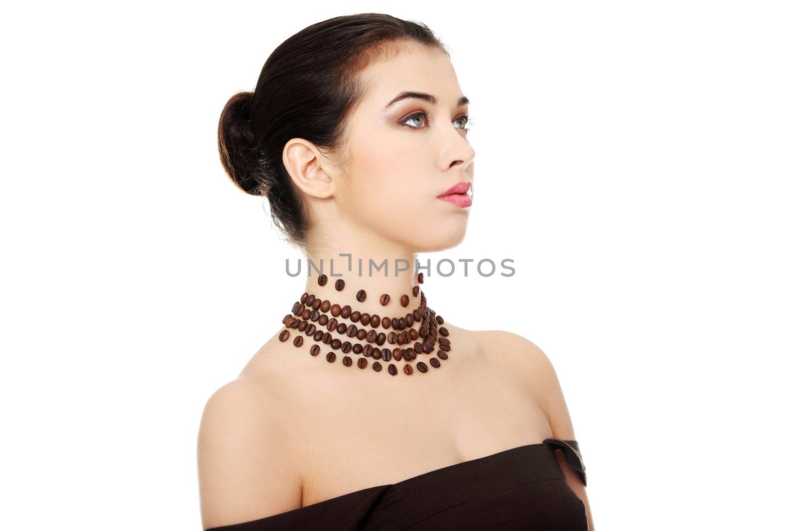 Beautiful elegant young woman with necklace made frome coffee beans, isolated on white